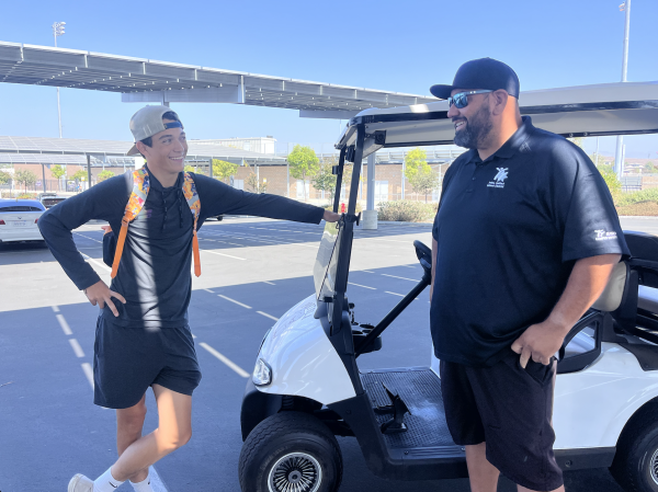 Senior Landon Durazo speaks with campus control staff member George Mares during lunch in the parking lot. “Some students get mad at the security guards because they don’t realize it is their job to tell students to get back to class,” Durazo said. “It gets good once you get to know them because they are interesting, and they are interested in stuff I am interested in.”